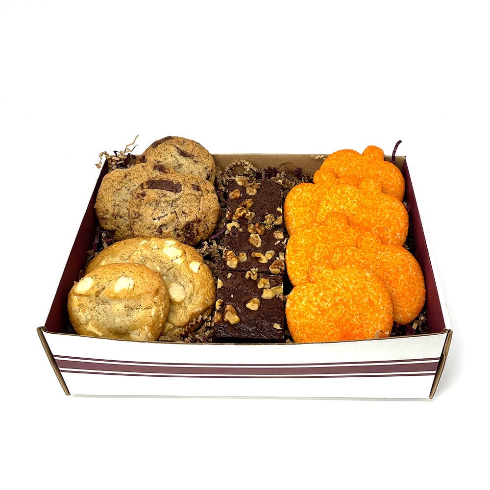 Dessert sampler containing a sample of chocolate brownies and sugar cookies from Gingerbread Construction Co. 