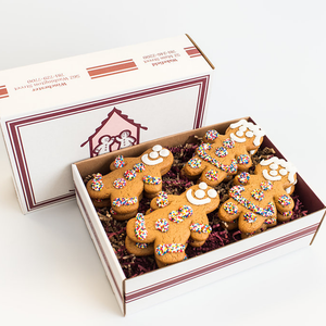 Flavorful gingerbread cookie 12-pack gift box packed with royal icing and non-pareils.