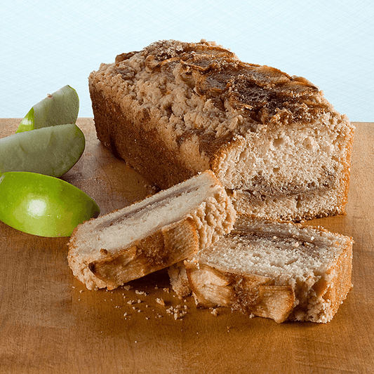 Apple crumb muffin loaf with apple filling and a crumb topping.