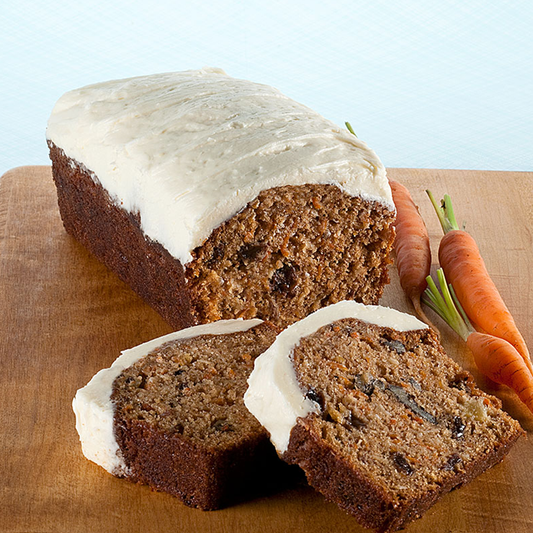 Carrot muffin loaf with shredded carrots, spices, raisins, and walnuts